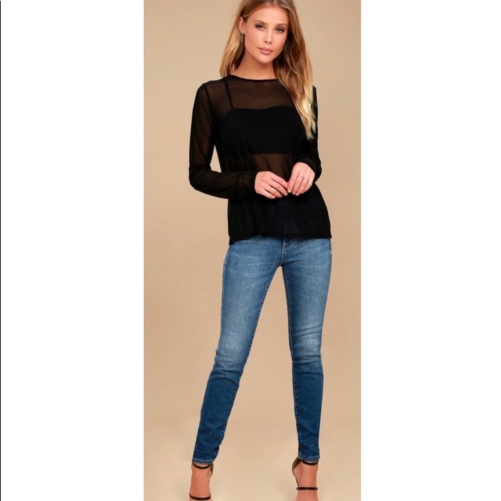 The Lulus Love Light Black Sheer Mesh Long
Sleeve Top is ready to hit the town!